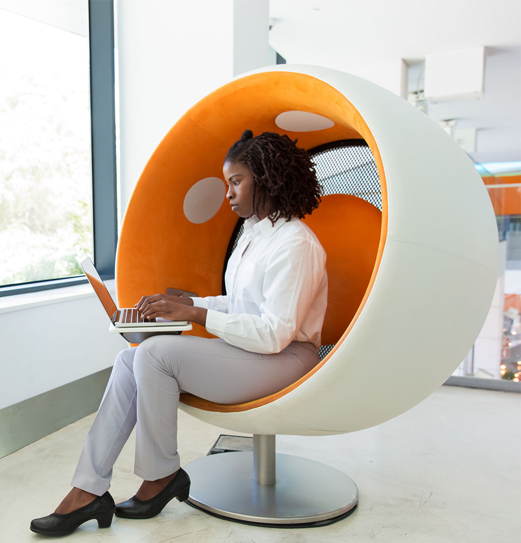 Serious young employee working in office rest room